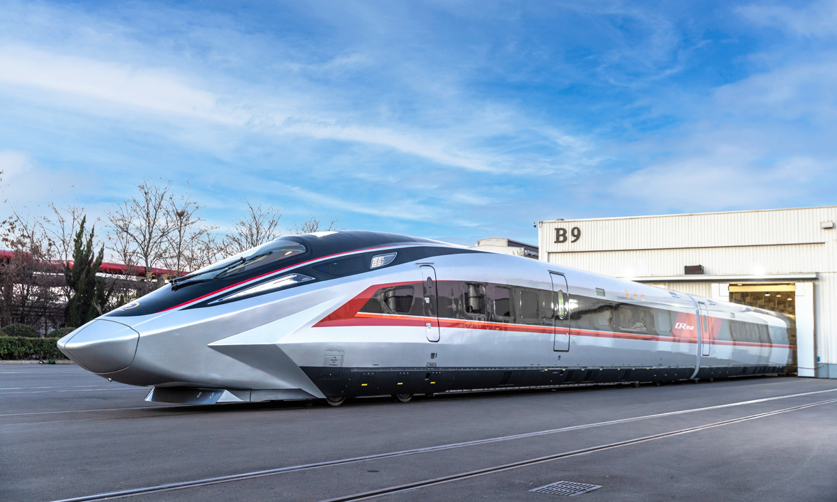 A prototype of the CR450 EMU (electric multiple units) high-speed train, China's most recently designed high-speed bullet train model, debuted in Beijing on December 29. When operational, it is expected to reach a speed of 400 kilometers per hour, making it the fastest high-speed train in the world. Photo: China Railway