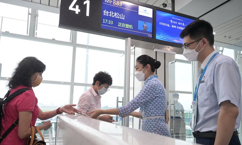  Passengers get their boarding passes checked before boarding the Flight MF883 at the Fuzhou Changle International Airport in Fuzhou, capital of southeast China's Fujian Province, May 22, 2023. Photo: CCTV