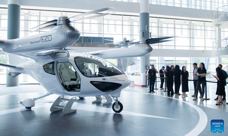 Visitors view an electric aircraft at an exhibition of the 2024 Low Altitude Economic Development Conference in Wuhu, east China's Anhui Province, Sept. 6, 2024. An exhibition displaying unmanned aerial vehicles, manned aircraft, airspace management systems, and other innovative hi-tech products of the low-altitude economy industry was held in Wuhu City during the ongoing 2024 Low Altitude Economic Development Conference (LAEC). As part of the three-day LAEC, the exhibition showcases low-altitude application scenarios in transportation, city management, emergency rescue, and many other fields. Photo: Xinhua