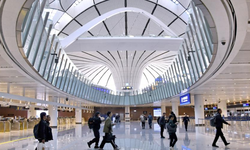 Foreign tourists go through customs at the Beijing Daxing International Airport in Beijing, capital of China, Dec. 27, 2024. On Dec. 17, China announced a significant relaxation of its visa-free transit policy, extending the permitted stay for eligible foreign travelers from the initial 72 hours and subsequent 144 hours to 240 hours, or 10 days.China recorded nearly 29.22 million inbound foreign visits between January and November 2024, up 86.2 percent year on year. Of these, 17.45 million entered the country visa-free, marking a significant 123.3 percent year-on-year growth. (Xinhua/Ju Huanzong)