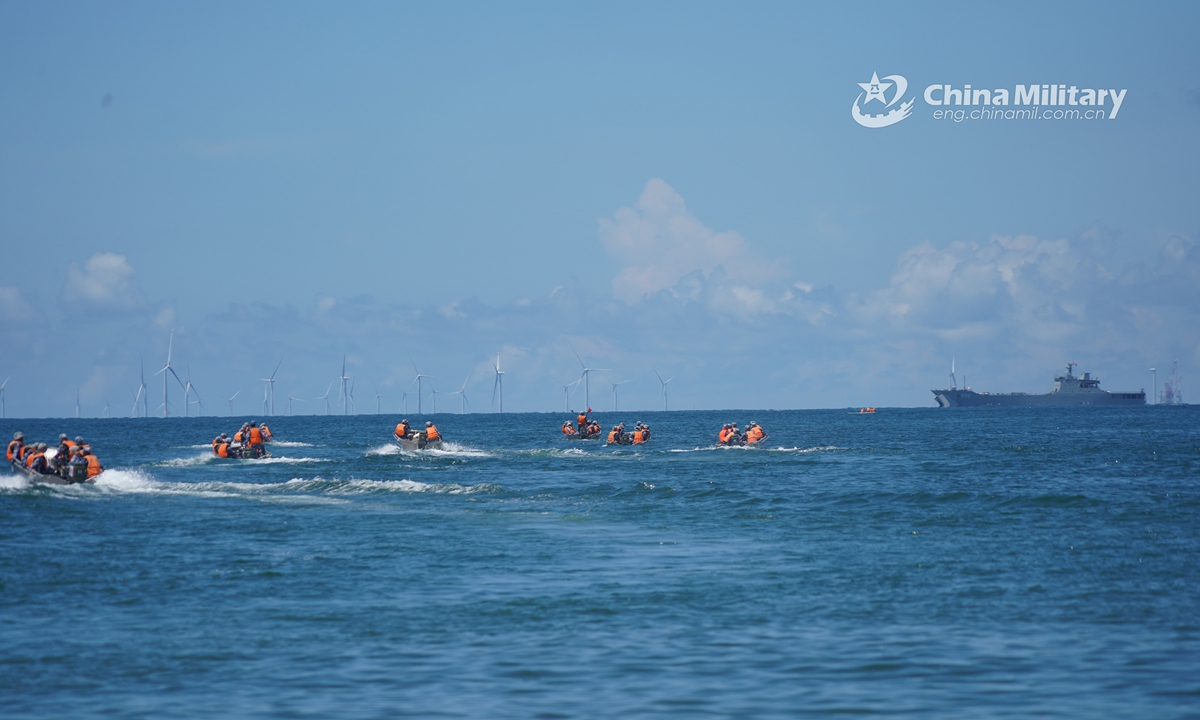 Several rigid-hull inflatable boats (RHIBs) attached to a brigade of the PLA Navy Marine Corps make their way to the beach-head during a maritime amphibious assault training in mid July, 2021. (eng.chinamil.com.cn/Photo by Liu Yuxiang)