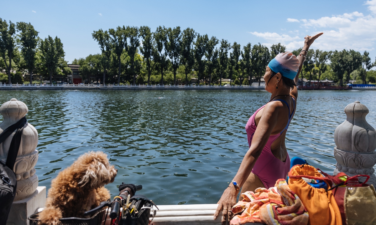 A woman swims in Houhai, Beijing on May 30. Photo: Li Hao/GT