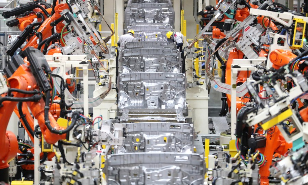 Robots conduct welding work at the workshop of an automobile manufacturing factory in Qingdao, east China's Shandong Province, Jan 14, 2023. Photo:Xinhua