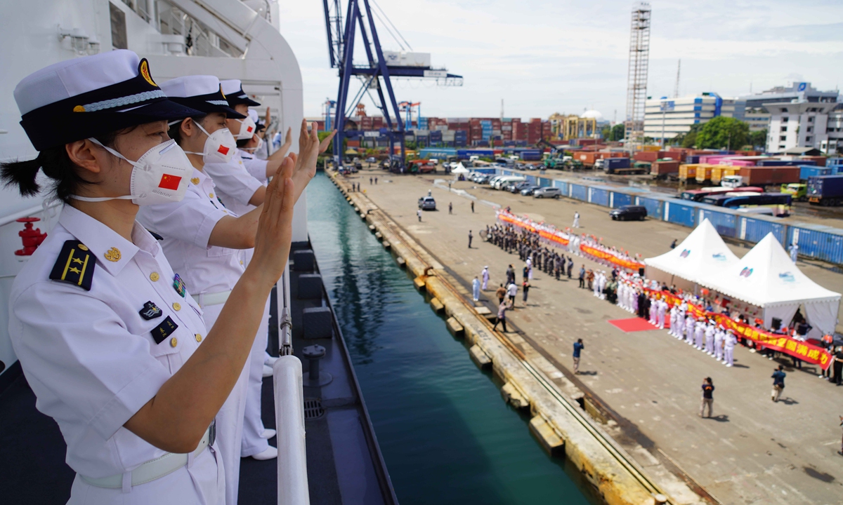 Soldiers and officers on the Chinese PLA Navy's hospital ship Peace Ark wave goodbye to people seeing them off on November 18, 2022 at the port of Tanjung Priok in Jakarta, Indonesia, after finishing an eight-day visit on Mission Harmony-2022. Photo: Xinhua