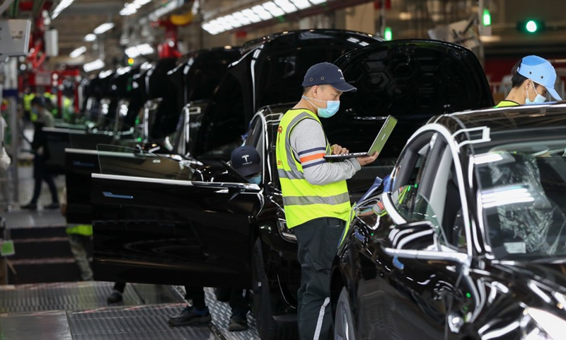 Employees work at the Tesla Gigafactory in Shanghai, east China, Nov. 20, 2020. Photo:Xinhua