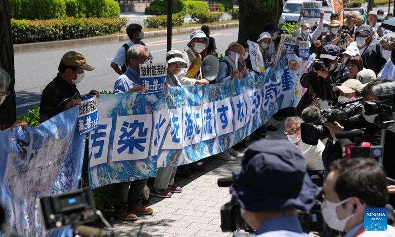 People rally in front of the Second Members' Office Building of the House of Representatives to protest against the Japanese government's plan to discharge nuclear-contaminated water into the sea in Tokyo, Japan, May 16, 2023. Hundreds of Japanese people on Tuesday gathered at multiple locations in Tokyo to protest against the government's plan to discharge nuclear-contaminated water from the crippled Fukushima Daiichi Nuclear Power Plant into the sea, demanding immediate suspension of such plan.(Photo: Xinhua)