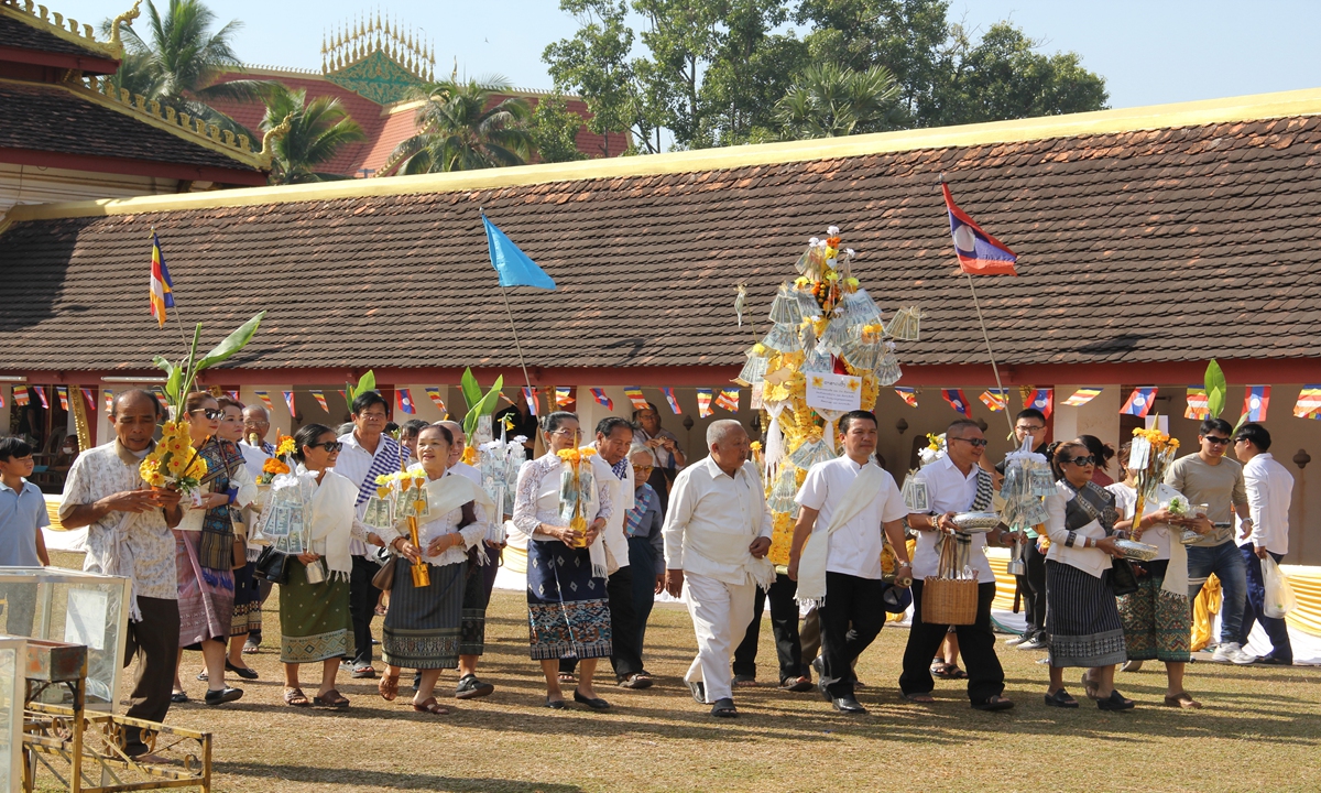 People attend the annual That Luang Festival in That Luang Stupa in Vientiane, Laos, on November 26, 2023. Considered as the most important religious festival in Laos, the That Luang Festival, which falls from November 23 to 27 this year, was observed by Lao people from all over the country around the That Luang Stupa. The China-Laos Railway has greatly facilitated Lao people's access to scenic spots across the country. Photo: Wang Qi/GT