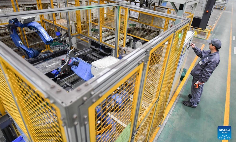 A staff member works at an auto parts factory in Liuyang City, central China's Hunan Province, Feb. 1, 2024.