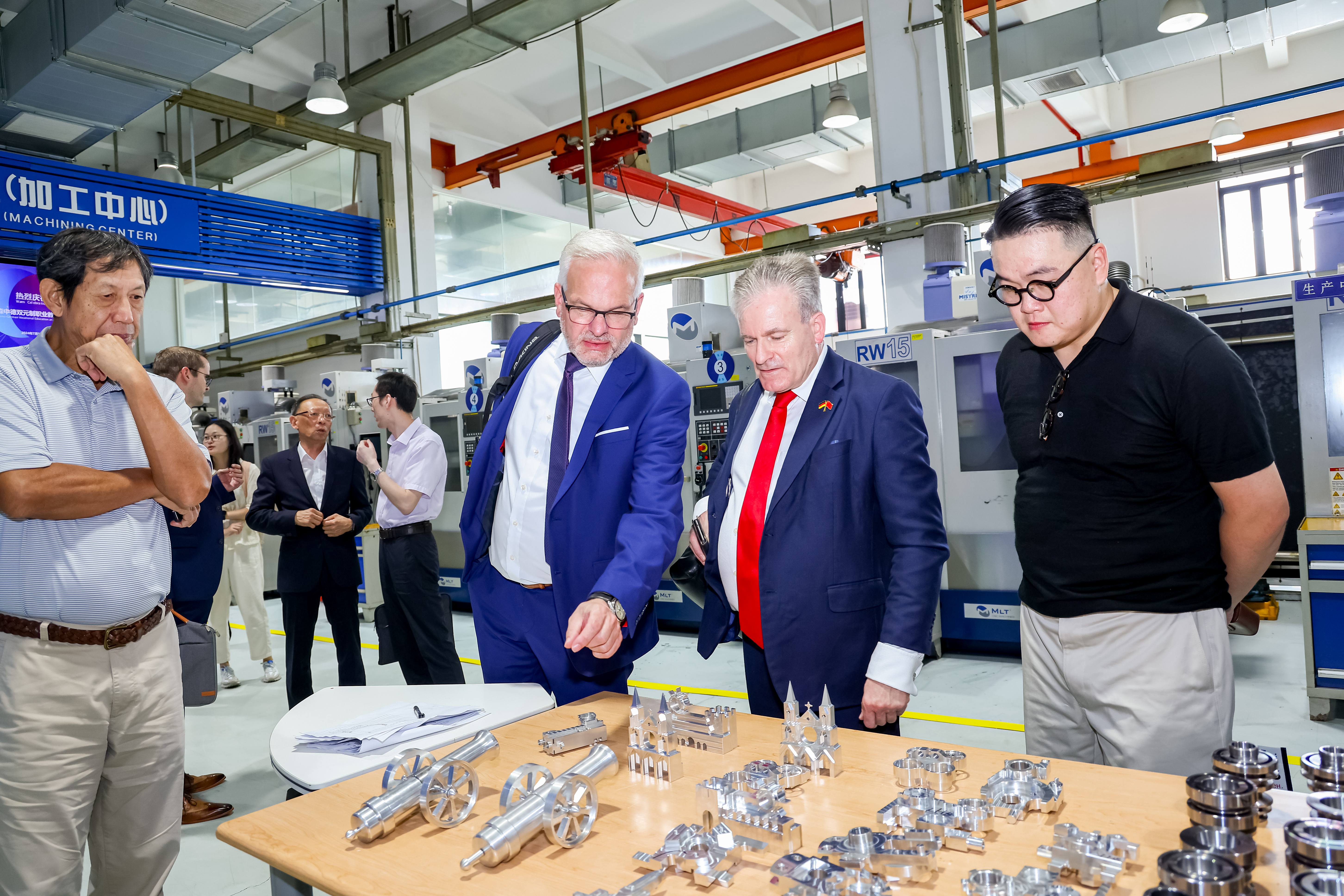 Representatives from companies and schools from China and Germany visit the training center of Shanghai Industrial Technology School on July 16, 2024. Photo: Courtesy of the organizer