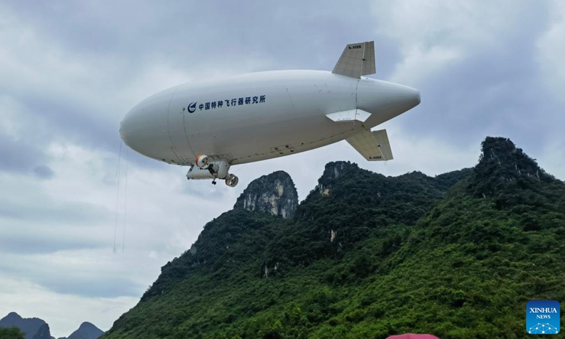 An AS700 civil manned airship arrives in Guilin, south China's Guangxi Zhuang Autonomous Region, Aug. 21, 2024. China's independently-developed AS700 civil manned airship on Wednesday completed its first trans-provincial ferry flight, according to the Aviation Industry Corporation of China (AVIC). (AVIC/Handout via Xinhua)