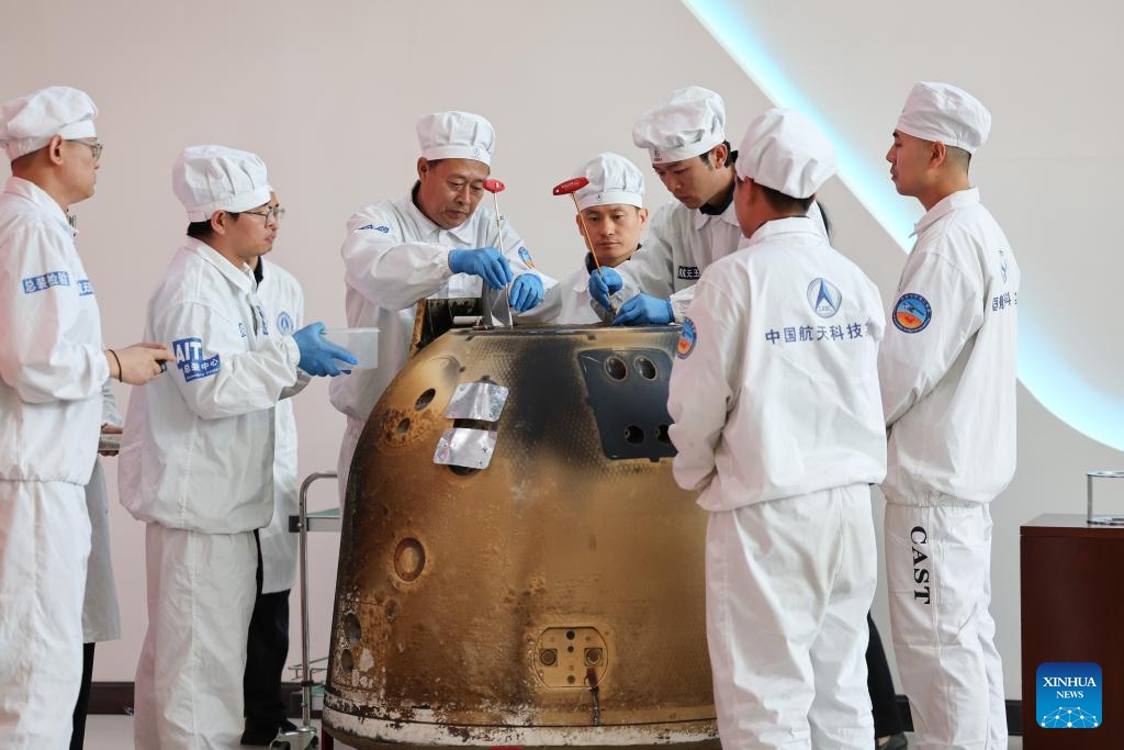 The returner of the Chang'e-6 lunar probe is opened during a ceremony at the China Academy of Space Technology under the China Aerospace Science and Technology Corporation in Beijing, capital of China, June 26, 2024. The returner of the Chang'e-6 lunar probe was opened at a ceremony in Beijing on Wednesday afternoon. During the ceremony at the China Academy of Space Technology under the China Aerospace Science and Technology Corporation, researchers opened the returner and examined key technical indicators.(Photo: Xinhua)