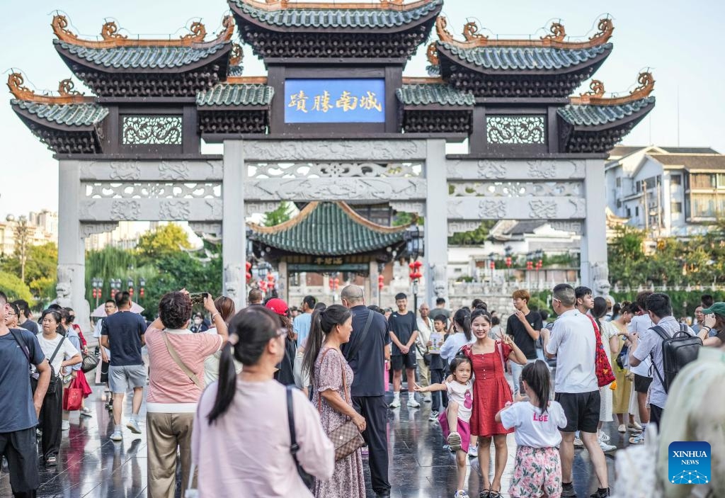 People visit Jiaxiu Pavilion scenic area in Guiyang, capital of southwest China's Guizhou Province, Aug. 13, 2024. Guizhou Province, with its cool climate and rich tourism resources, attracts tourists from all over the country during the peak summer travel season. (Photo: Xinhua)