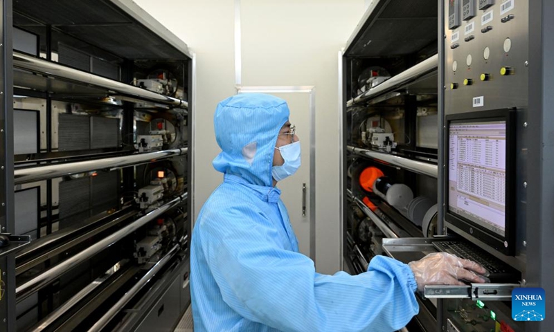 A staff member of Anhui North Microelectronics Research Institute Group Corporation Limited works on the production line of MEMS wafers in the China Sensor Valley at Bengbu City, east China's Anhui Province, Sept. 12, 2024. China Speech Valley in Hefei City, the Vision Valley of China in Wuhu City and China Sensor Valley in Bengbu City, are three key demonstration zones for the artificial intelligence (AI) industry in Anhui Province. (Photo: Xinhua)