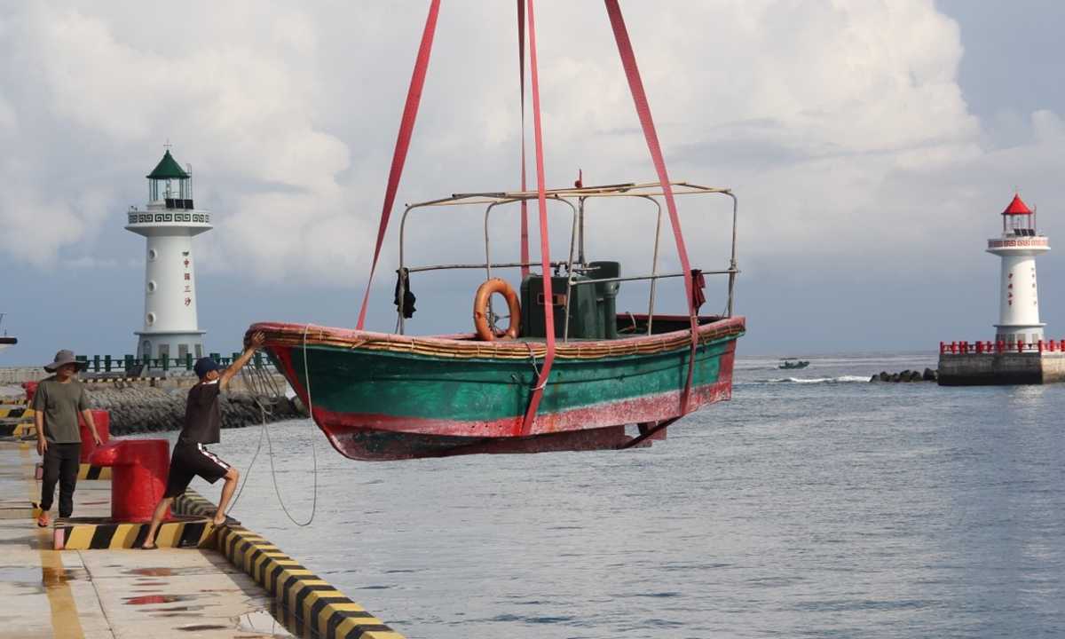 Chinese fishermen move their boats from shore to the sea before heading out to fishing on September 24, 2024 at a dock on Yongxing Island, Sansha city, South China's Hainan Province. Photo: Wang Qi/GT