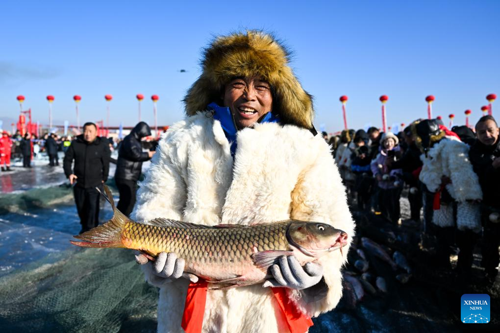 Winter fishing event held in Hasuhai scenic area in Hohhot, N China