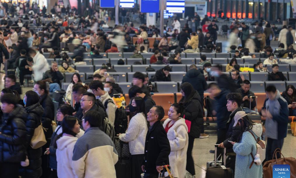 Passengers are seen at the waiting hall of Wuhan Railway Station in Wuhan, central China's Hubei Province, Jan. 20, 2025. As this year's Spring Festival travel rush began on Jan. 14, China Railway Wuhan Bureau Group Co., Ltd. has scheduled to add 47 overnight high-speed trains daily towards major cities from Jan. 20 to 27, in an effort to better cater for passengers. (Xinhua/Wu Zhizun)