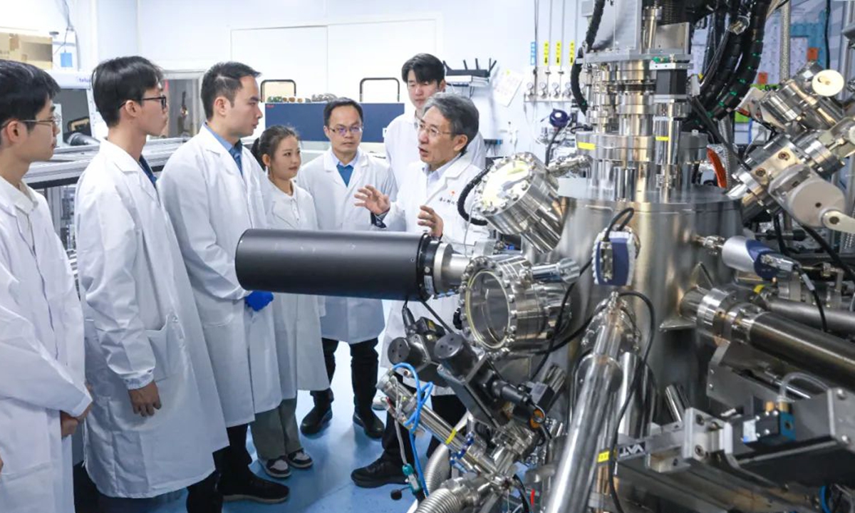 Xue Qikun, an academician from the Chinese Academy of Sciences and president of Southern University of Science and Technology (SUSTech) and his research team work in a lab. Photo: Southern University of Science and Technology (SUSTech) 